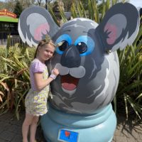 Little girl at Longleat wearing a Koala thumb guard