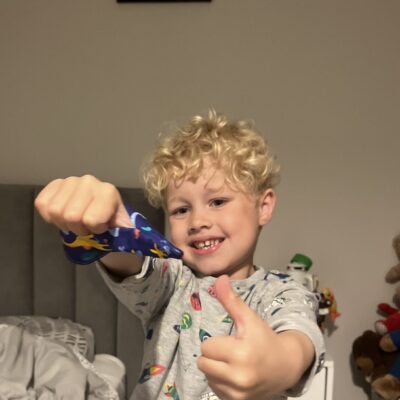 Little boy wearing a fabric thumb guard