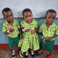Children in Ghana wearing Thumbsies