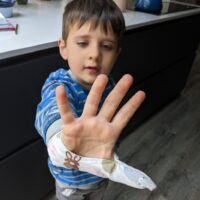 Little boy wearing a bunny fabric thumb guard