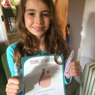 girl with stop thumb sucking certificate