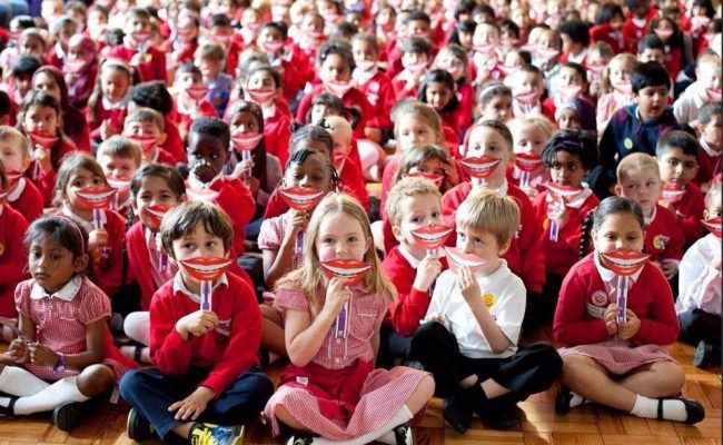 School children supporting National Smile month