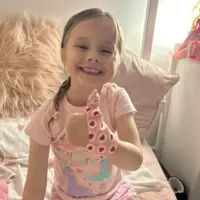 Little girl wearing a Thumbsie Thumb Glove