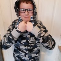 boy wearing coo thumb guards and hoodie